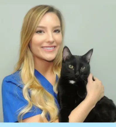 Kim holding a black cat